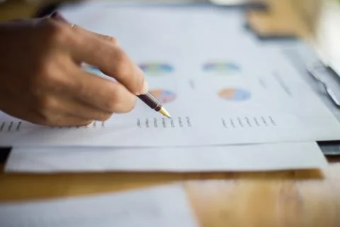 Business team working on laptop, while sitting at office. Business people. Stock Photos