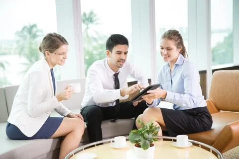 Business Team Working on Tablet Computer Stock Photos
