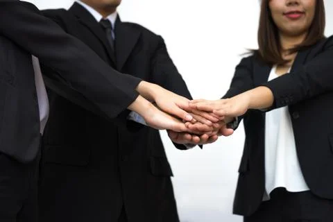 Business teamwork concept with hands stacking of businessman and businesswome Stockfoto's
