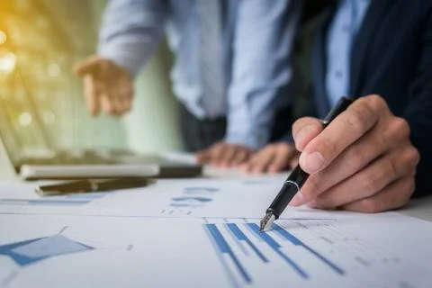 Business teamwork process, Businessmen hands pointing at laptop and document Stock Photos