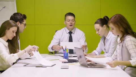 Business teamwork of young managers and chief during serious and active scrum Video stock 80799507