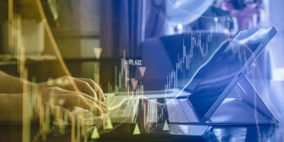 Business technology concept. Hands using computer keyboard with glowing finan Stock Photos