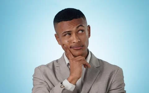 Business, thinking and man with solution, planning and problem solving on a blue Stock Photos