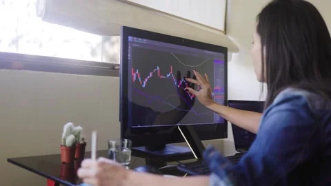 Business trader using crypto exchange app for investment and stock market analys Stock Footage 277336632