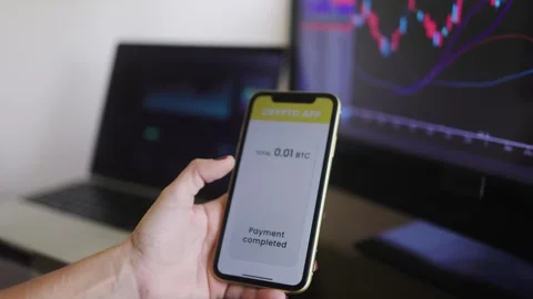 Business trader using crypto payment service app with mobile phone   Stock Footage 276481042