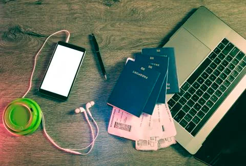 Business Travel computer and objects on office desk Stock Photos