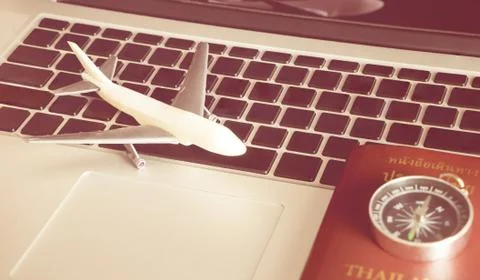 Business traveler objects on computer notebook 库存照片