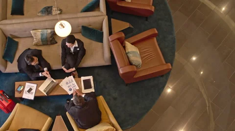 Business Travelers Meeting in the Hotel Lobby Stock Footage