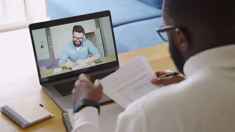 Business tutor and student talking holding video call online chat conversation Stock Footage 154910652