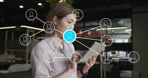 Business user tapping tablet while network overlay showing user links, blue node Stock Footage 329910049