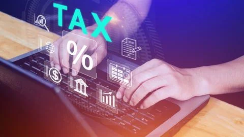 Business using computer to complete Individual income tax return form onlin.. Stock Photos