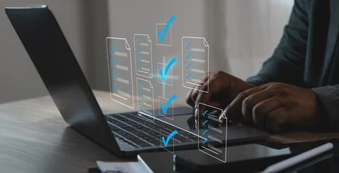 Business using a laptop with digital checklist and virtual file interface, .. 스톡 사진