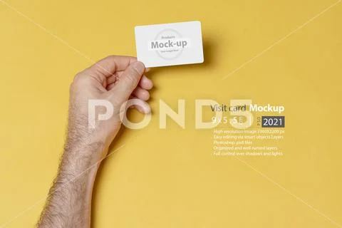 Business visit card in male hand mock-up series PSD Template