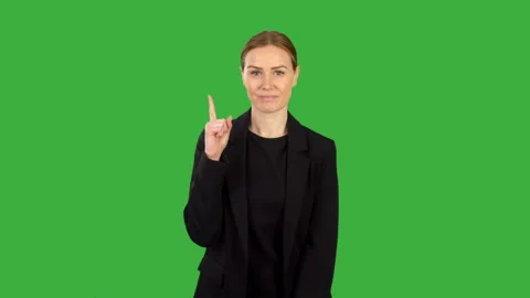 A business woman in black pointing up wi... | Stock Video | Pond5