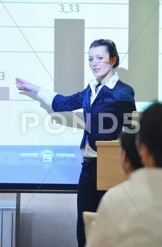 Business woman giving presentation Stock Photos