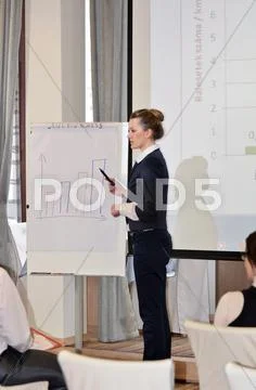 Business woman giving presentation Stock Photos