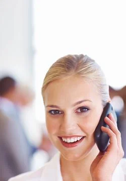 Business woman with handy phone. Closeup of cute young female executive on call Stock Photos