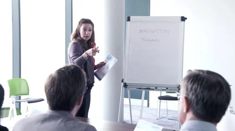 Business woman interacting and writing on white board Stock Footage 59379786