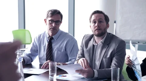 Business woman interacting with executives in conference room Stock Footage 59380089