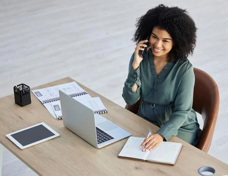 Business woman, laptop and phone call in office for tech communication or Stock Photos