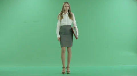 Business woman looking folder with documents on green screen Stock Footage 63146140