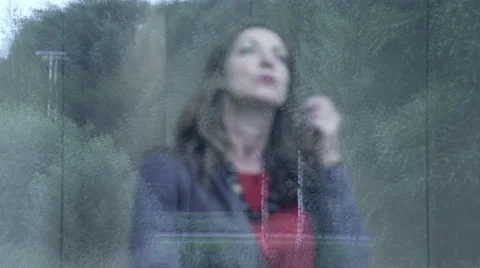 Business woman looking through window Stock Footage 59385539