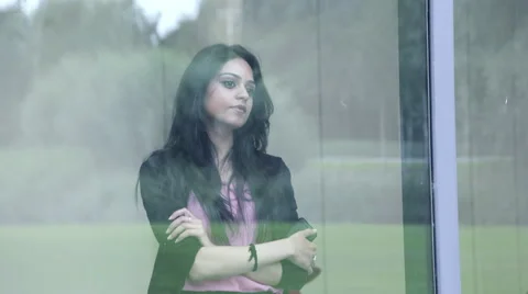 Business woman looking through window Stock Footage 59385783