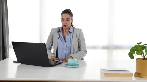 Business woman problem with computer virus or bug on laptop Stock Footage 218612414