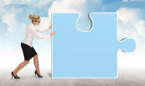 Business woman pushing puzzle piece on sky background Stock Photos