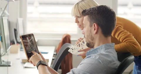 Business woman showing 3d printed object in Creative business team meeting in Stock Footage 59128279
