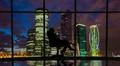 The business woman sits in the office near the windows with a night city view Photo