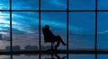 The business woman sits in the office near the windows with a beautiful sky v Photo