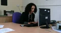 Business woman sitting at computer, working fast HD Footage