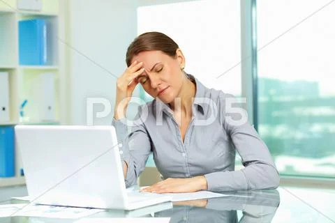 Business woman suffering from headache Stock Photos