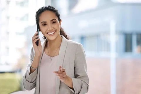 Business woman talking on her phone. Female entrepreneur making a call on her Stock Photos