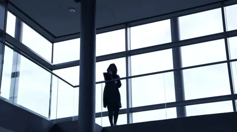 Business woman talking on phone in office corridor Stock Footage 59383434