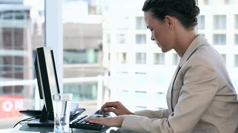 Business woman using a computer Stock Footage 11435597