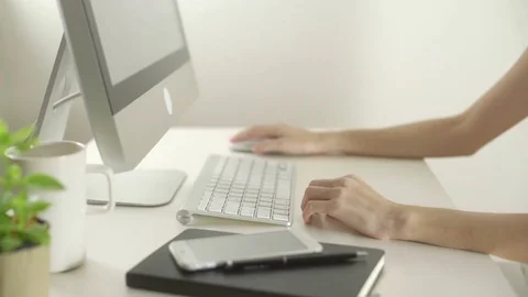 Business woman using computer with wireless mouse for surfing internet in office Stock Footage 80004672