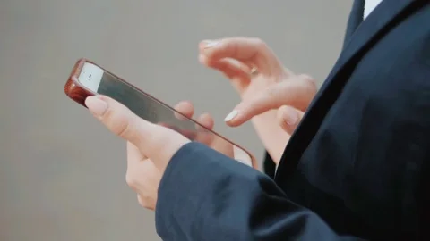 Business woman using mobile device. Close up. Focus on hands. Technology concept Stock Footage