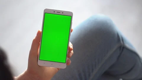 Business woman using smartphone viewing green screen on mobile phone browsing Stock Footage