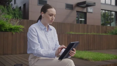 Business Woman Using Tablet Computer Reading Financial News Online Stock Footage 262367762