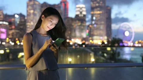 Business woman working on cellphone in Hong Kong city Stock Footage
