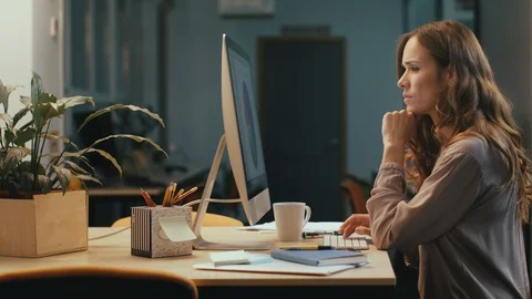 Business woman working late in office. Serious woman finding mistake. Stock Footage