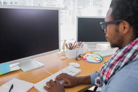 Business worker with reading glasses on computer Stock Photos