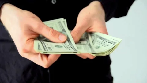 Business worker's hands counting dollar banknotes at the office. Concept of.. Stock Footage 266476210