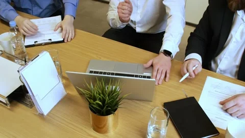 Business Workers as they delve into diverse business matters at table and Vidéo 270541953