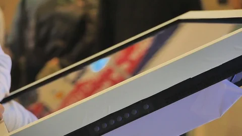 Businesses operate on a large touch screen Video stock 69897507
