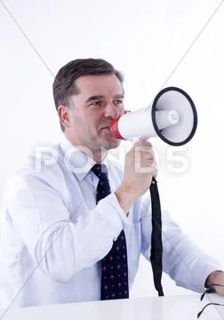 Businessman, 50+, using a megaphone Stock Photos