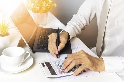 Businessman access document data and verify the accuracy of the data.,The c.. Stock Photos