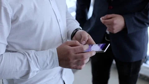 Businessman Adding Tasks In Phone Notepad Video stock 76327135